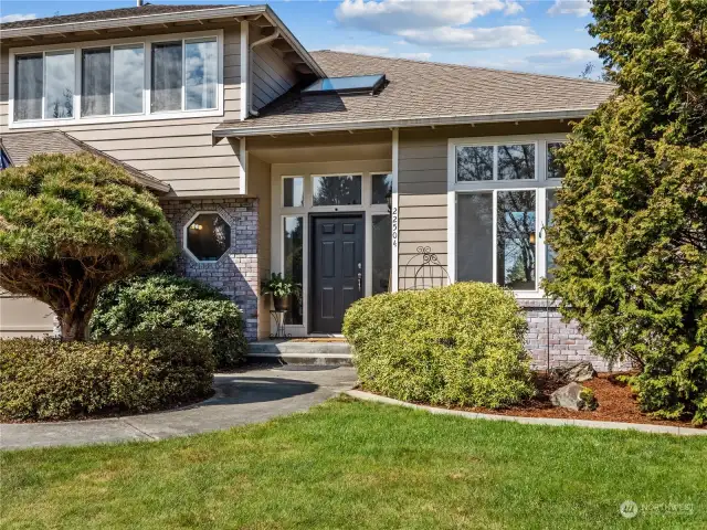 You will experience a warm welcome as you enter through the freshly painted front door. The front of the home has eastern exposure. Great variety of flowering plants, trees, and shrubs.