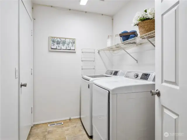 Your laundry room is steps away from the kitchen and doubles as a mudroom. The door leads to the garage.