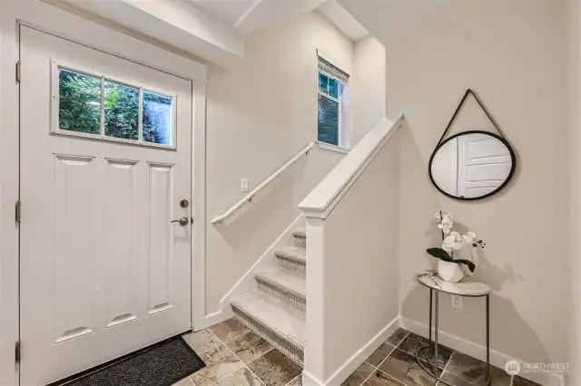 Inviting entry with large coat closet.