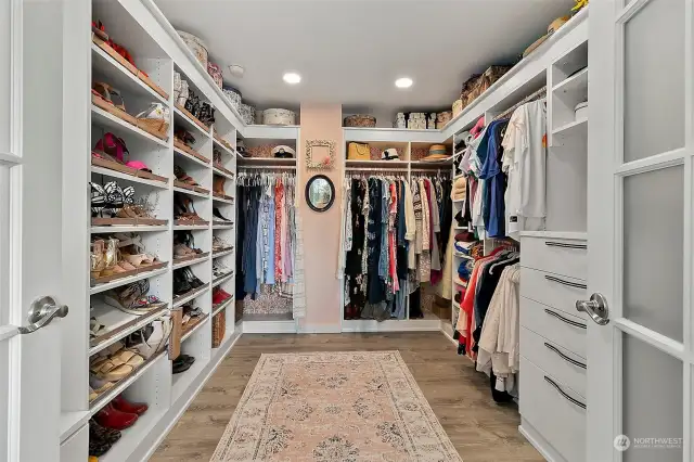 This large "celebrity closet" and dressing room is amazing - room for all your shoes, boots, clothes, hats, with built-ins galore and tucked away behind classy French doors.  (This is the original build design 4th bedroom that was redone to this amazing dressing space, but has been previously used as a sitting area, office and nursery.)