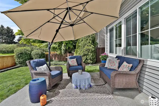 The large back patio is designed for entertaining and enjoying the sweeping water view.