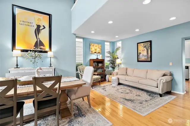 Cheerful fresh paint, oak hardwood floors and soaring ceilings greet you as you enter the front door with room for formal dining and living room furnishings.