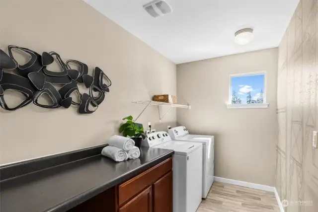 Enjoy having an upper level laundry facility where you won't have to run up and down stairs.  The elongated counter space provides a perfect place to fold the freshly washed clothes.