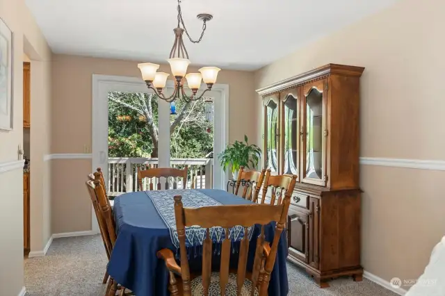 Large formal dining area has slider out to back yard deck, wonderful for entertaining or just enjoying the peaceful sound of birds chirping.