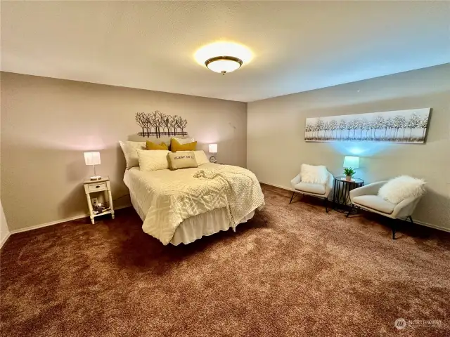 Nice size primary bedroom with room for a king size bed and night stands.