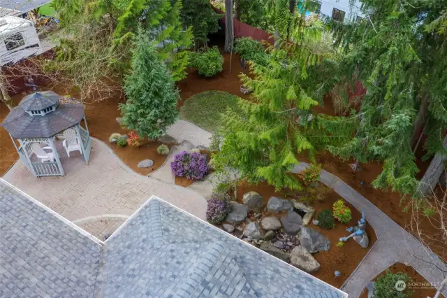 View of the backyard paver patio and gazebo.