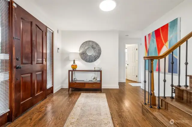 Enter into luxury with a spacious entry and gleaming hardwood floors.