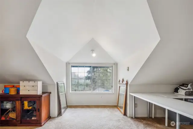 Want something special? This lofted room is on the 4th floor and overlooks the backyard and back of property. Who doesn't love a mystery? It's entry is secreted away behind a bookcase!