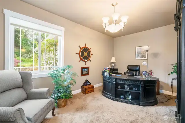 The main floor office is functional and Gorgeous, and it provides an intimate look out to the home's gardens.