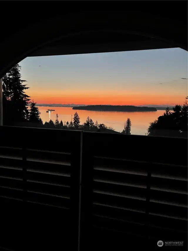 Sunset from the deck. Puget Sound, Blake Island, ships passing in the night.