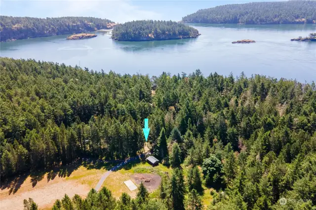 Center Island 1/2 acre lot with partial water view, power, water and septic on site.