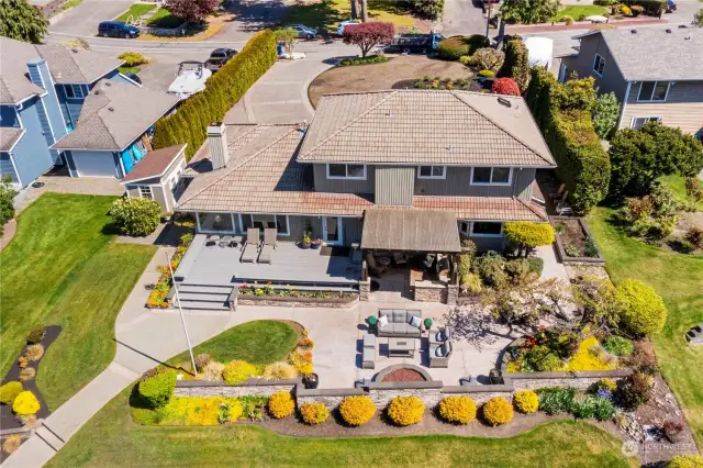 Immaculate retreat boasts pristine, sun-kissed Western exposure sunsets from this outdoor paradise.  Outdoor living year round with covered area, gas firepit and space to lounge