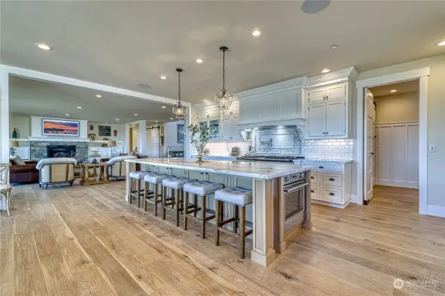 The kitchen serves as the hub of the great room, and is designed for entertaining. The massive island features a Carrera Marble top, seating for 5, and a wall oven mounted in the end for that Thanksgiving turkey.