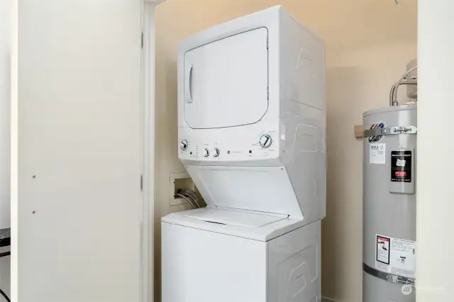 Utility closet with washer, dryer and hot water heater