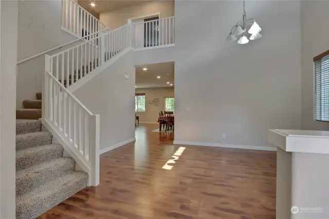 Living room at Entry.  spindle staircase leading upstairs.