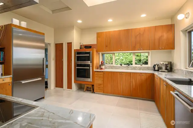 Renovated in 2019, the kitchen has 2 Miele ovens (steam and convection, Miele refrigerator & dishwasher and Gaggenau induction cooktop w/ hood and seating area