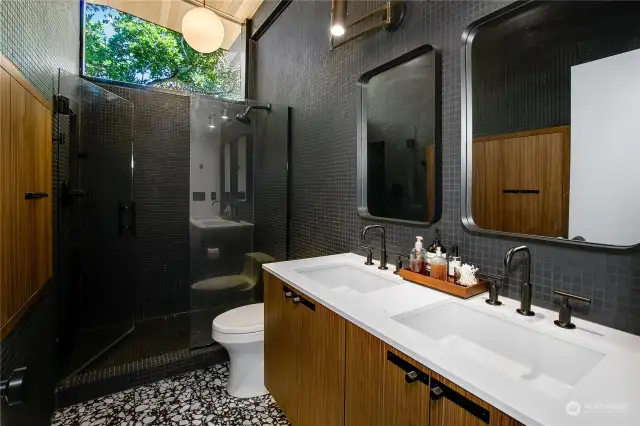 Indulge in the spacious walk-in shower and dual vanity bathroom, offering both luxury and functionality.