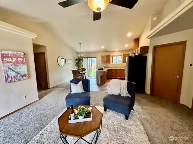 Great Room Design...You will enjoy the light and area living room with vaulted ceiling and new carpet!