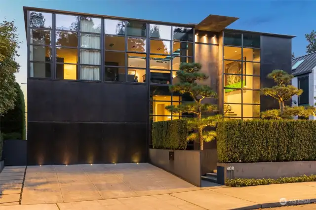 Steel, glass and concrete masterpiece by Tom Kundig and Dowbuilt.   Two car garage + lift for third car.