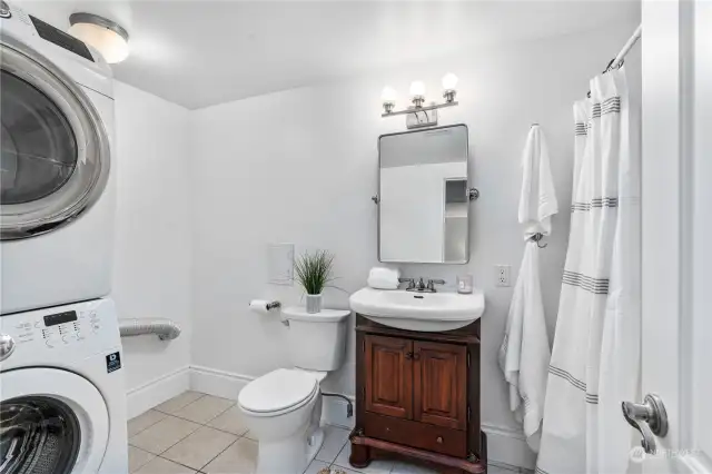 Lower-level full bathroom and laundry room.