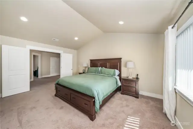 Spacious primary bedroom with walk in closet and 5 piece bath