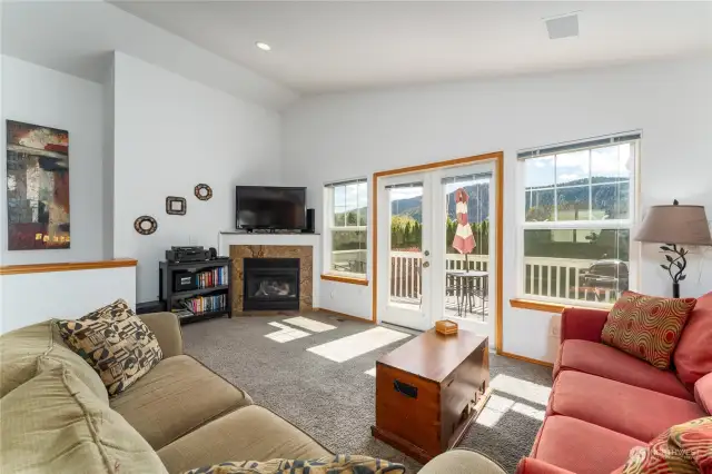 Family room with deck with Cascade Mountain views