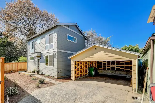 Set back off the street with a fenced yard and a detached, EV-ready garage, this 2 bed, 2.25 bath home features a livable floor plan and sun-soaked windows with southerly exposure