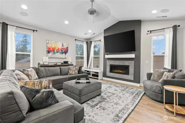 The family room with its vaulted ceilings and gas fireplace invites relaxation.