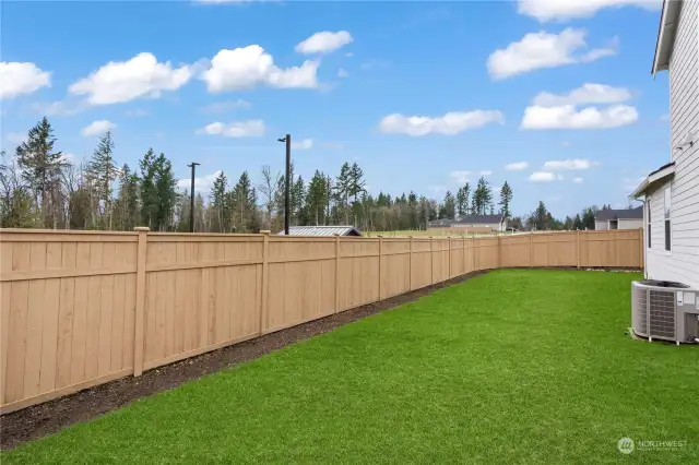 Fully fenced backyard for added privacy.