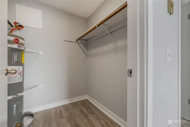 Walk-in closet with ample storage.