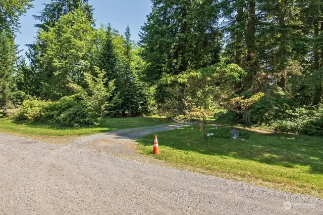 Driving north on 113th Ave NE, a private gravel road, look for the orange cone and house number 6417 on a white sign. This is your driveway to the cabin  number
