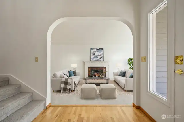 Softened arch opening to  formal living off entry