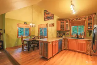Open kitchen, that flows into a small dining area. storage, and newer appliances.