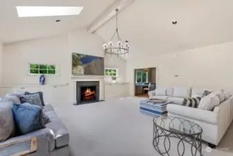 Generous sized family gathering room with additional fireplace.