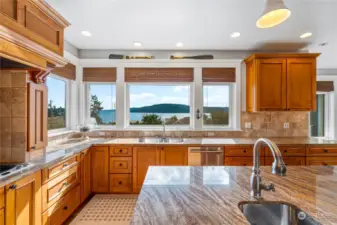 Extra prep sink in the center island - two disposals; one at each sink. High end cabinetry all around. It is a gourmet cook's dream kitchen.