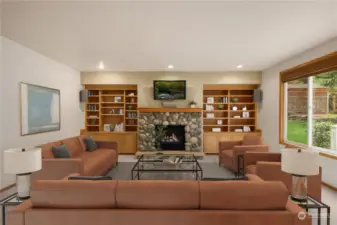 Family Room located next to the kitchen.    Virtual Staging to demonstrate the many options!  Gas fireplace, built-in cabinets and shelving.