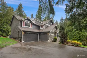 Oversized 3 car garage with extra deep stalls for exceptional storage and workshop space.
