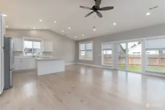Built-in living room fan, dining room off to the right of kitchen and access to the backyard