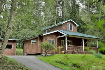 Welcome to this delightful cabin nestled in the trees above Honeymoon Lake.
