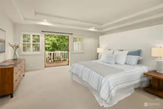 Spacious primary suite with French doors to private deck