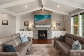 Cozy up on stormy nights beside the floor-to-ceiling stone gas fireplace.