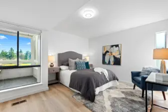 The primary bedroom has a large viewing window, looking out at the golf course from the deck,  with a second window to the right for more light thru the day. This is a very spacious room. Also like all the overhead lights, they are new.