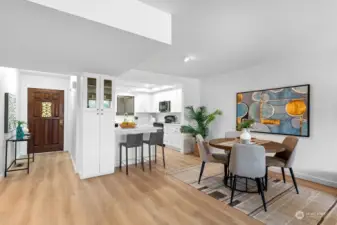 Looking back at the entry, notice the large cabinet next to the kitchen counter with 2 chairs. Also there can be 2 more chairs from the kitchen side of the counter. Very spacious with additional dining area.