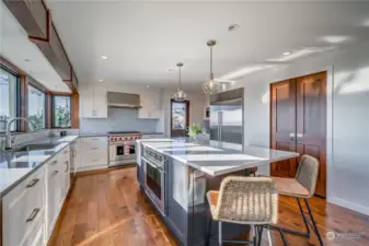 Kitchen with professional Wolf and Subzero appliances, walk-in pantry.