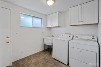 At the rear of the house you will find the laundry/mudroom with  a sink and storage area