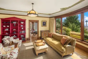 The sunny and bright dayroom functions as an everyday family room and has sparkling views spanning the Space Needle to Alki Point and beyond!