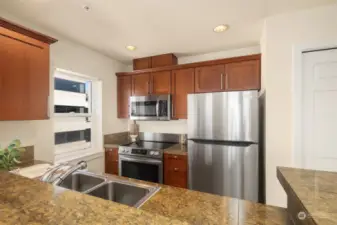 Brand new stainless steel appliances in the kitchen including the dishwasher not pictured. Plenty of counter space and storage with a full size pantry.