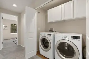 Large laundry closet with storage. Washer and dryer stay with property!