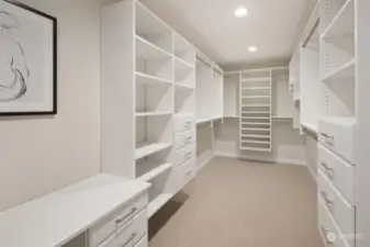 Main floor primary walk-in closet and vanity desk.