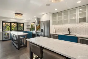 Lower level kitchen, quartz counters, high end stainless steel appliances, tile backsplash